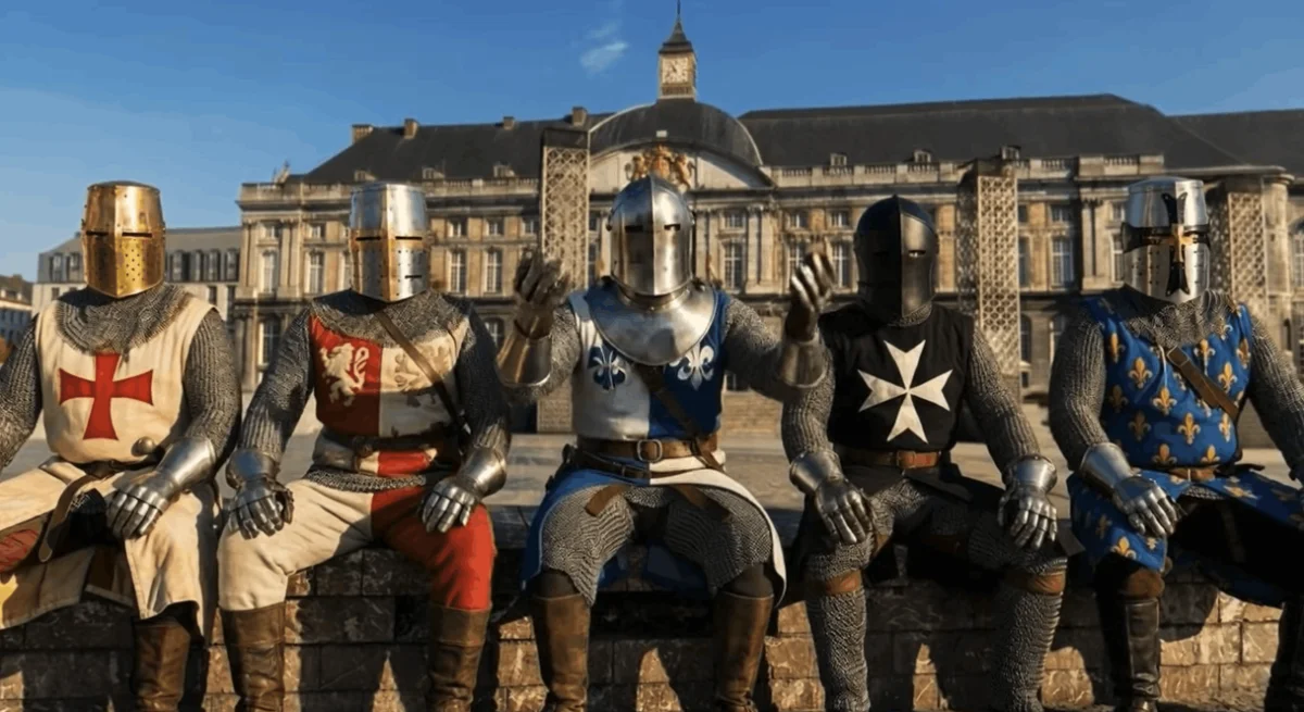 Cinq chevaliers en armure assis devant un palais, clip musical Ma belle cathédrale.